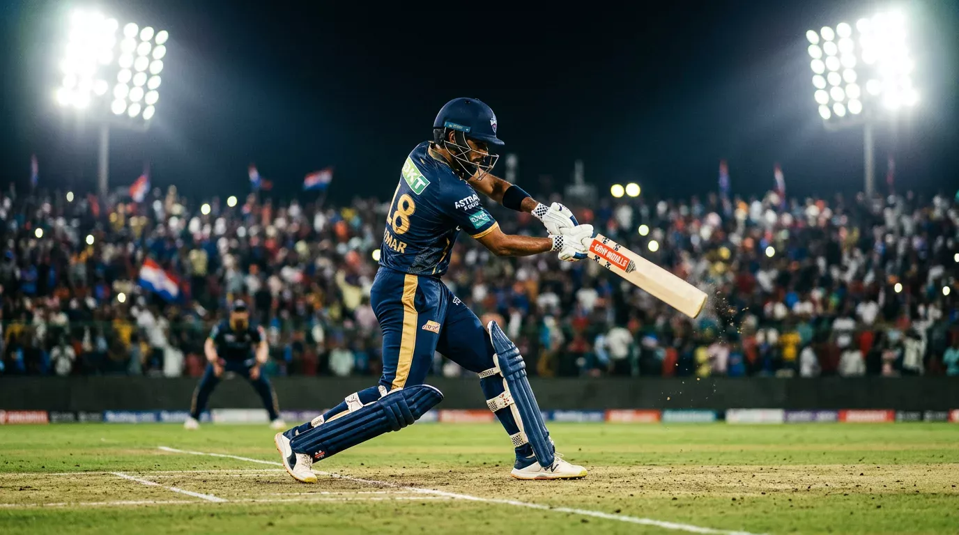 Bateador de cricket en posición de golpeo durante un partido nocturno de la IPL